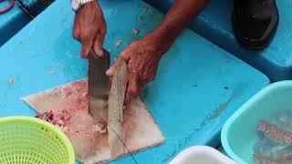 Killing live Spotted Sicklefish  On Board at Seafood Floating Market in Sai Kung Hong Kong